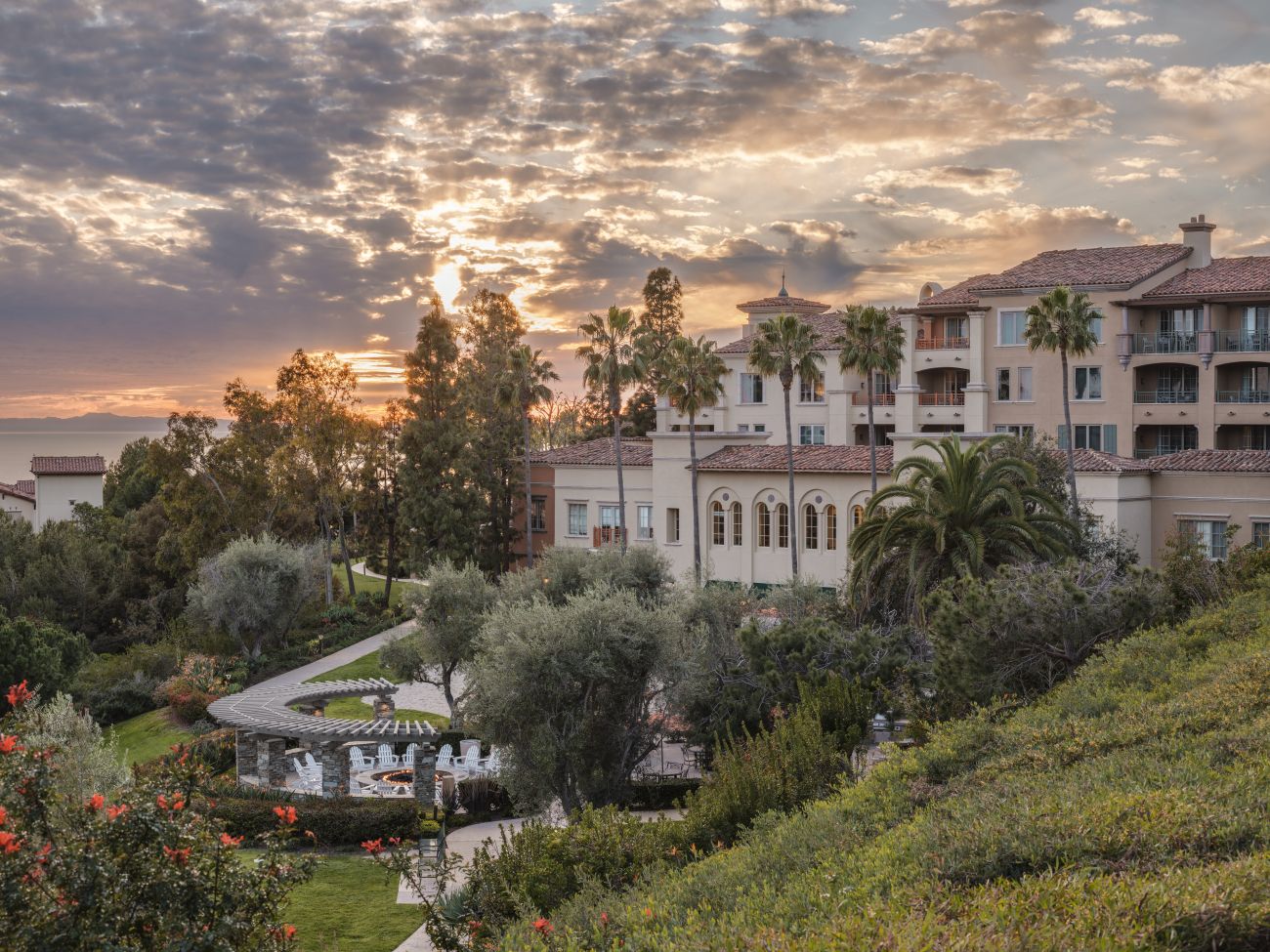 Exterior of Marriott's Newport Coast Villas resort timeshare with sun setting over water